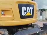a yellow bulldozer that is parked on the side of the road