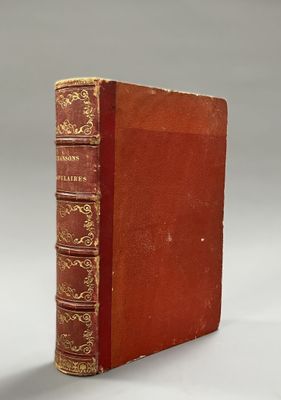 an old book sitting on top of a table next to a white background
