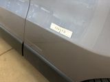 a sticker on the side of a car that is parked in a garage