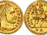 a gold coin with an image of a man riding on a horse