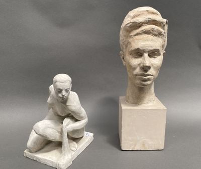 two statues of a man and a woman on display
