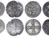 six different types of silver coins with a cross on one side and a cross on the other