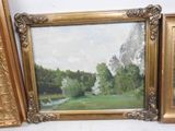 three framed pictures of trees and a river in the background