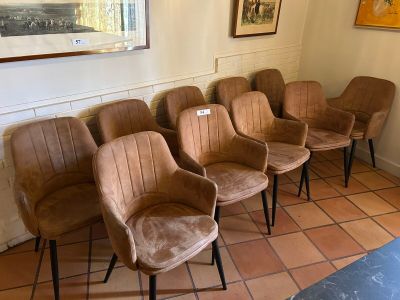 five chairs in a row in a room with a painting on the wall