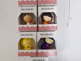 six boxes with different figurines in them on a table