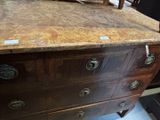a dresser with a mirror on top of it in a room