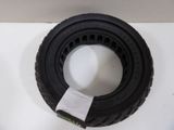 a black tire with a white tag on it