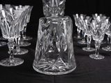 a lot of wine glasses that are sitting on a table