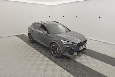 a grey suv parked in a garage with a checkered floor