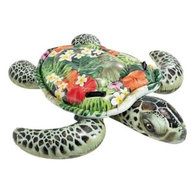 une statue représentant une tortue avec des fleurs sur le dos
