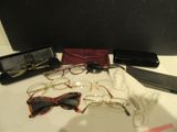 a lot of glasses and a cell phone on a table