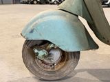 a scooter that is sitting in a parking lot