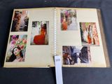 an open book with pictures of a woman in a red dress
