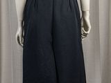 the mannequin is wearing a white shirt and black skirt