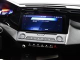 a car dashboard with a digital display in the center