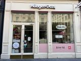 a store front with a sign that says hagger donuts