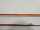 a pair of fishing rods sitting next to each other on a table