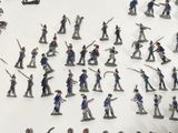 a lot of toy soldiers that are on a table