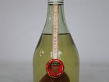 a bottle of wine that is sitting on a table