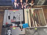 a lot of records on the table with pictures on them