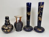 three vases are sitting next to each other on a table