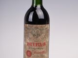 a bottle of wine that is sitting on a table