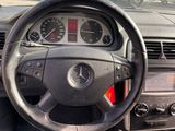 dashboard of a car with a steering wheel and dashboard gauges