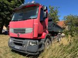 a red truck that is parked in the grass