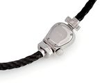 a silver watch on a black leather strap on a white surface