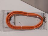 an orange cord that is on top of a white table