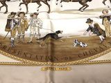 a scarf with a picture of a group of people riding horses