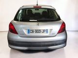a silver car that is parked in a white room