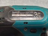 a close up of a cordless drill on a table