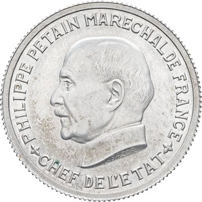 une image représentant une pièce d'argent sur laquelle figure le portrait d'un homme