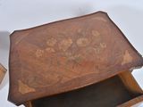 a small wooden box with a floral design on it