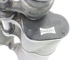 a close up of a metal object with a white background