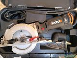 a circular saw in a case with a corded cutter