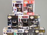 a pile of batman pop vinyl figures on a table