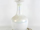 an image of a white glass lamp with a cord