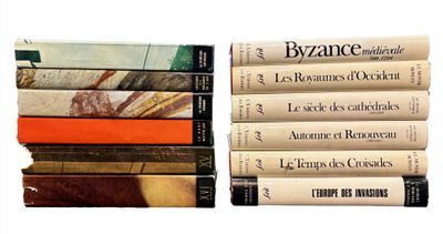 several books stacked on top of each other on a white surface