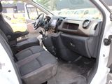 the interior of a car with the door open and the driver ' s seat down