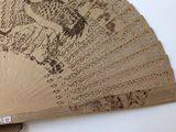 a close up of a fan with a design on it