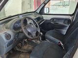 the interior of a car with the door open showing the steering wheel and dashboard