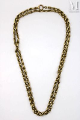 a gold chain necklace with a heart charm on it