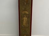 a tall wooden pole that has a painting on it