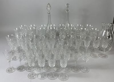 a lot of wine glasses that are sitting on a table