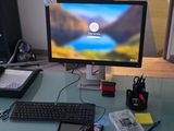 a computer desk with a monitor and keyboard on it