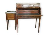 a small desk with a drawer and a table with a drawer on it