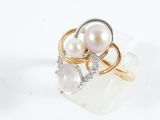 pearl and diamond ring on a white background