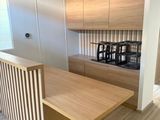 a kitchen with a wooden counter top and wooden cabinets